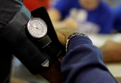 A man has his blood pressure checked at the Remote Area Medical Clinic in Wise, Virginia, U.S., July 22, 2017. PHOTO BY REUTERS/Joshua Roberts