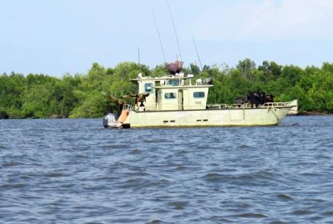 A military gunboat is seen on a river in Nigeria's Delta region, April 3, 2011. PHOTO BY REUTERS/Joe Brock