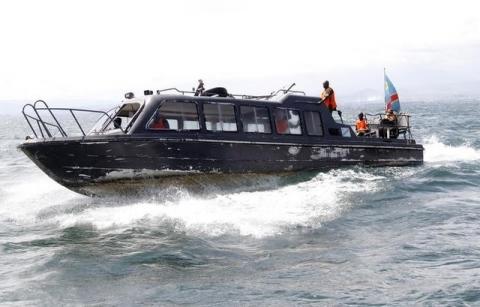 Congolese soldiers use their boat to search for passengers of a boat that capsized in Lake Kivu near Goma in eastern Democratic Republic of Congo, May 6, 2014. PHOTO BY REUTERS/Kenny Katombe