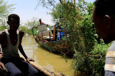 Sudanese people use boats to carry their belongings as they paddle through the flood waters near the River Nile in Khartoum localities, Sudan, September 2, 2019. PHOTO BY REUTERS/Mohamed Nureldin Abdallah