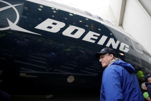 An employee is pictured as the first Boeing 737 MAX 7 is unveiled in Renton, Washington, U.S., February 5, 2018. PHOTO BY REUTERS/Jason Redmond