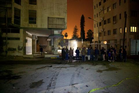 People gather at the scene where a car bomb exploded late on Saturday close to the recently re-opened Italian embassy in Tripoli, Libya, January 21, 2017. PHOTO BY REUTERS/Stringer