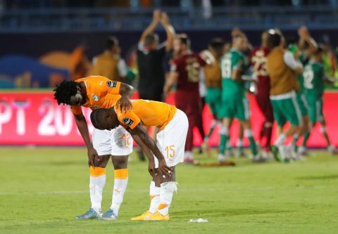 Ivory Coast's Wilfried Bony and Max Gradel react after the match. PHOTO BY REUTERS/Mohamed Abd El Ghany