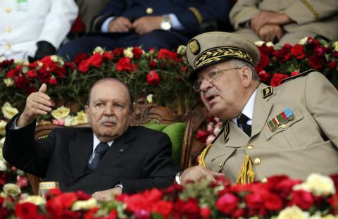 Algeria's President and head of the Armed Forces Abdelaziz Bouteflika (L) gestures while talking with Army Chief of Staff General Ahmed Gaid Salah during a graduation ceremony of the 40th class of the trainee army officers at a Military Academy in Cherchell 90 km west of Algiers, June 27, 2012. PHOTO BY REUTERS/Ramzi Boudina