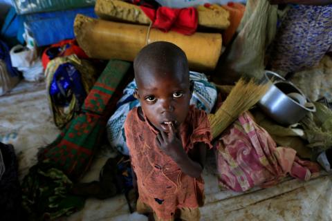 A displaced boy from South Sudan stands next to family belongings in Lamwo after fleeing fighting in Pajok town across the border in northern Uganda, April 5, 2017. PHOTO BY REUTERS/James Akena 