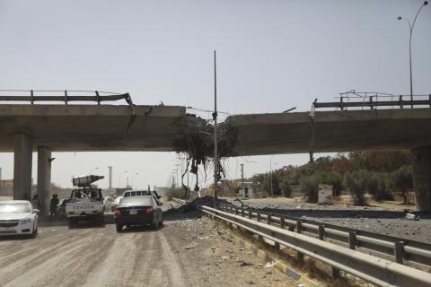 A general view of the damage of the 27th Bridge is seen along a road linking Tripoli and the western Libyan cities, near a former Libyan Army camp known as Camp 27 following clashes between rival militias in the 27 district, west of Tripoli