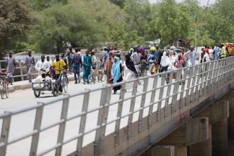 People cross a bridge in Borno, Nigeria, April 27, 2017. PHOTO BY REUTERS/Afolabi Sotunde