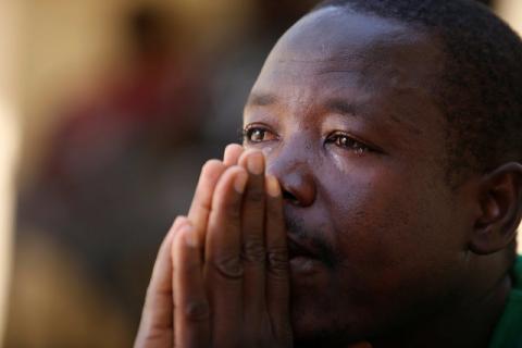 Bubacar Samba, a Gambian migrant who voluntarily returned from Libya, reacts during an interview at his home in Brikama, Gambia, April 5, 2017. PHOTO BY REUTERS/Luc Gnago