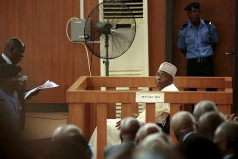 A court clerk reads the charges to Nigeria Senate President Bukola Saraki at the Code of Conduct Tribunal at Darki Biu, Jabi Abuja, Nigeria, September 22, 2015. PHOTO BY REUTERS/Afolabi Sotunde