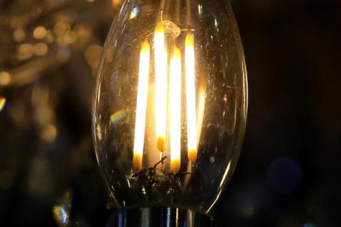 A light bulb in a lamp is seen in a file photo. PHOTO BY REUTERS/Mariana Bazo