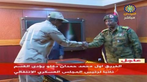 Sudan's General Abdelfattah Mohamed Hamdan Dagalo, head of the Rapid Support Forces, is sworn in as deputy head of Sudan's Transitional Military Council, standing before the head of the council, Lieutenant General Abdel Fattah Al-Burhan Abdelrahman (R) in Khartoum, Sudan April 13, 2019 in this still image taken from video. PHOTO BY REUTERS/Sudan TV