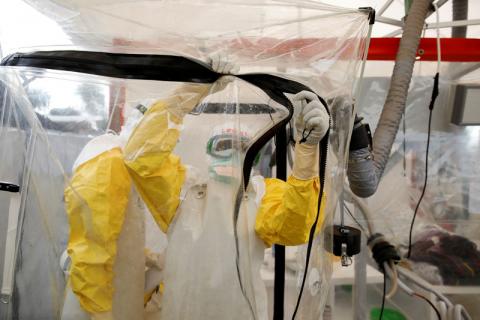 A health worker wearing Ebola protection gear enters the Biosecure Emergency Care Unit (CUBE) at the ALIMA (The Alliance for International Medical Action) Ebola treatment centre in Beni, in the Democratic Republic of Congo, April 1, 2019. PHOTO BY REUTERS/Baz Ratner
