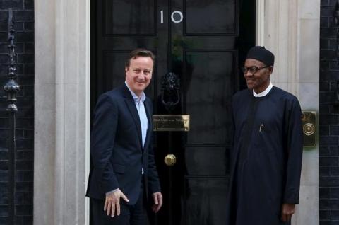 Nigeria's President-elect Muhammadu Buhari (R) departs after meeting with Britain's Prime Minister David Cameron at Downing Street in London, England, May 23, 2015. PHOTO BY REUTERS/Neil Hall