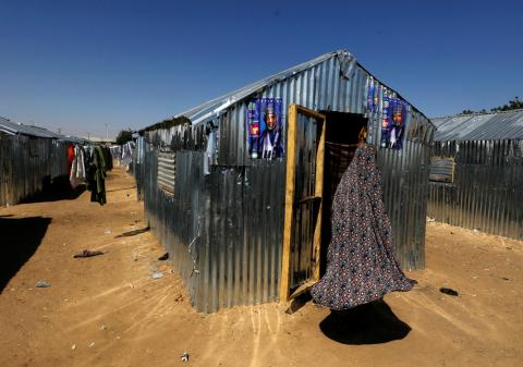 An internally displaced woman enters her shelter at the Teachers' Village IDP camp in Maiduguri, Nigeria, January 16, 2019. PHOTO BY REUTERS/Afolabi Sotunde