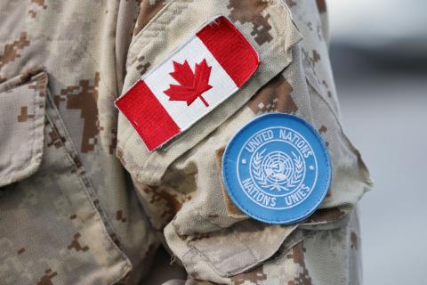 A Canada flag patch and U.N. patch are seen on a member of Canadian Forces before departing for a United Nations peacekeeping mission in Mali, at Canadian Forces Base Trenton in Trenton, Ontario, Canada, July 5, 2018. PHOTO BY REUTERS/Chris Wattie