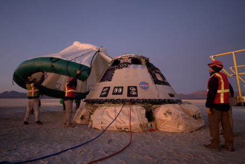 A protective tent is placed over the Boeing CST-100 Starliner spacecraft, which had been launched on a United Launch Alliance Atlas V rocket, after its descent by parachute following an abbreviated Orbital Flight Test for NASA’s Commercial Crew programs in White Sands, New Mexico, U.S., December 22, 2019. PHOTO BY REUTERS/NASA/Bill Ingalls