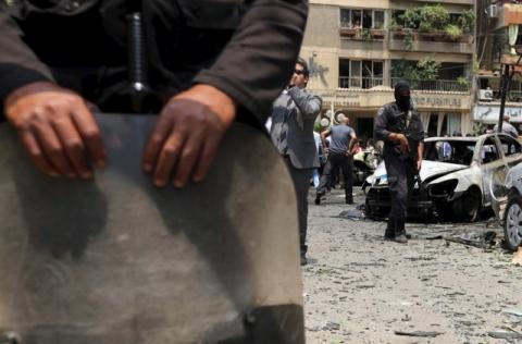 A policeman secures the site of a car bomb attack on the convoy of Egyptian public prosecutor Hisham Barakat near his house at Heliopolis district in Cairo, Egypt, June 29, 2015. PHOTO BY REUTERS/Mohamed Abd El Ghany