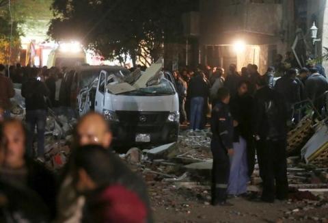 Damaged cars are seen at the scene of a bomb blast in Giza, Egypt, January 21, 2016. PHOTO BY REUTERS/Mohamed Abd El Ghany