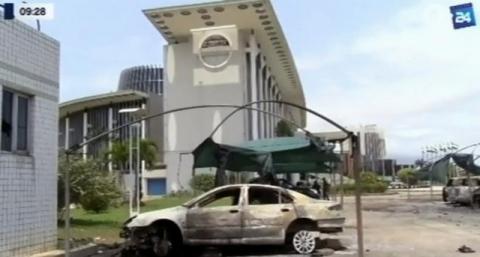 A still image from video of a fire damaged vehicle outside the national assembly building in Libreville, Gabon, September 2, 2016. PHOTO BY REUTERS/GABON 24 TV