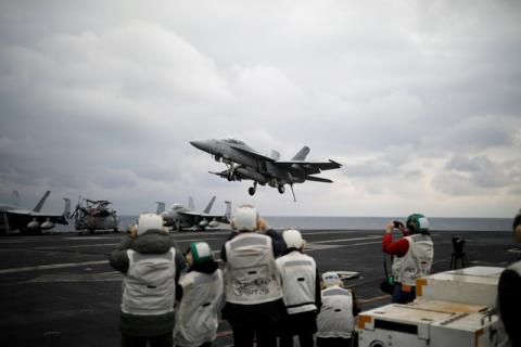 A U.S. F18 fighter jet lands on the deck of U.S. aircraft carrier USS Carl Vinson during an annual joint military exercise called "Foal Eagle" between South Korea and U.S., in the East Sea, South Korea, March 14, 2017. PHOTO BY REUTERS/Kim Hong-Ji