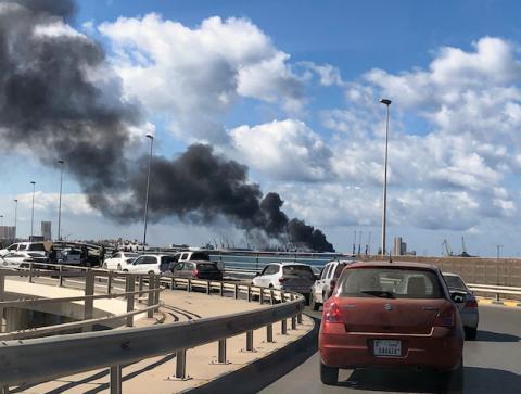 A smoke rises from a port of Tripoli after being attacked in Tripoli, Libya, February 18, 2020. PHOTO BY REUTERS/Ahmed Elumami