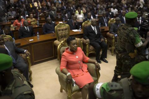 New parliamentary-elected interim President of the Central African Republic Catherine Samba-Panza sits surrounded by African Union (AU) peacekeeping soldiers prior to her swearing-in ceremony at the National Assembly