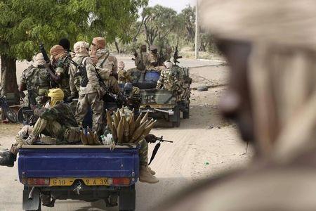 Chadian soldiers drive in the recently retaken town of Damasak, Nigeria, March 18, 2015. PHOTO BY REUTERS/Emmanuel Braun