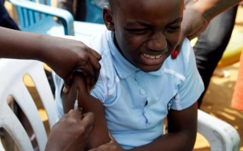 A Congolese child is vaccinated during an emergency campaign of vaccination against yellow fever in Kisenso district, of the Democratic Republic of Congo's capital Kinshasa, July 20, 2016. PHOTO BY REUTERS/Kenny Katombe