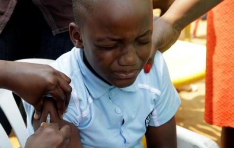 A Congolese child is vaccinated during an emergency campaign of vaccination against yellow fever in Kisenso district, of the Democratic Republic of Congo's capital Kinshasa, July 20, 2016. PHOTO BY REUTERS/Kenny Katombe