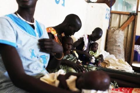 Malnourished children are being held by their mothers in the Medecins Sans Frontieres (MSF) hospital in Leer, July 15, 2014. PHOTO BY REUTERS/Andreea Campeanu