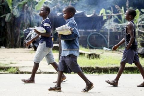 Children return from school in the mid-morning, in Ikarama village on the outskirts of the Bayelsa state capital, Yenagoa, in Nigeria's delta region, October 8, 2015. PHOTO BY REUTERS/Akintunde Akinleye