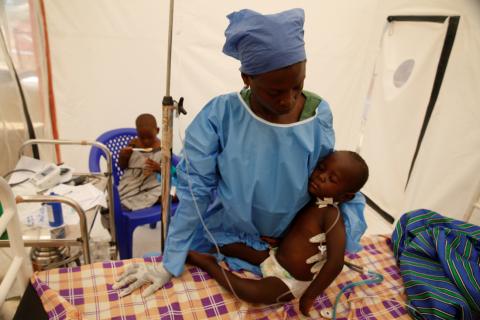 Ebola survivor Jeanine Masika Mbuka Furana Katungu holds Furana Katungu, a two-year-old confirmed ebola patient, inside the Biosecure Emergency Care Unit (CUBE) at the ALIMA (The Alliance for International Medical Action) Ebola treatment centre in Beni, Democratic Republic of Congo, March 31, 2019. PHOTO BY REUTERS/Baz Ratner