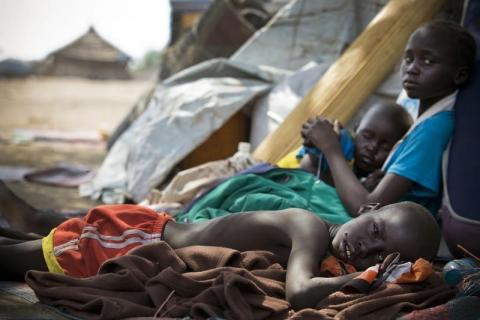 Children displaced by fighting in Bor rest upon arriving in Mingkaman refugee camp