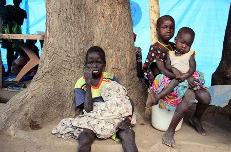 South Sudanese children sit outside their makeshift shelter in SPLA-IO rebel control area in the Southern part of Unity State Paynjiar County, March 20, 2015. PHOTO BY REUTERS/Denis Dumo