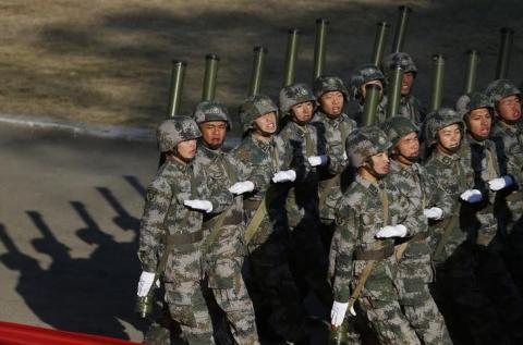 Soldiers of the Chinese People's Liberation Army march during their drill ahead of their year-end review in Jiaxing, Zhejiang province, November 29, 2013. PHOTO BY REUTERS/William Hong