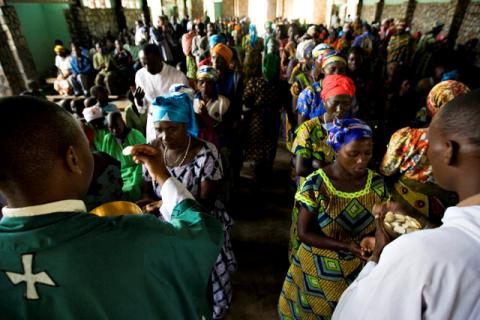 Congolese churchgoers receive communion at Sunday mass in the village of Mweso in eastern Democratic Republic of Congo, February 8, 2009. PHOTO BY REUTERS/Finbarr O'Reilly