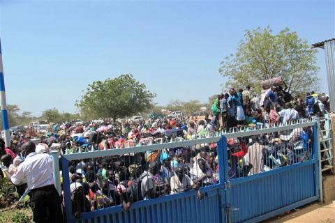 Civilians arrive for shelter at the United Nations Mission in the Republic of South Sudan (UNMISS) compound in Bor