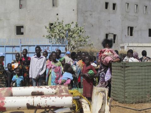 Civilians arrive outside the United Nations compound on the outskirts of capital Juba in South Sudan, in this December 16, 2013 handout from the United Nations Mission in South Sudan (UNMISS)