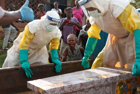 A mother of a child, suspected of dying from Ebola, cries near her child's coffin in Beni, North Kivu Province of Democratic Republic of Congo, December 17, 2018. PHOTO BY REUTERS/Goran Tomasevic