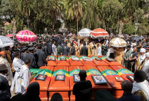 Pallbearers and other people attend the burial ceremony of the Ethiopian Airline Flight ET 302 crash victims at the Holy Trinity Cathedral Orthodox church in Addis Ababa, Ethiopia, March 17, 2019. PHOTO BY REUTERS/Maheder Haileselassie