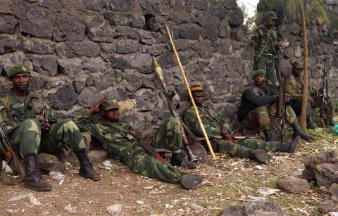 Congolese government soldiers take a break after patrolling