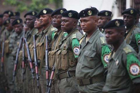 Congolese peacekeepers from the Multinational Force of Central Africa (FOMAC) listen to morning instructions from their commander at the FOMAC base in Bossangoa, Central African Republic