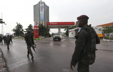 Congolese security forces secure the street near the state television headquarters in the capital Kinshasa