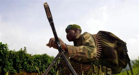 Congolese soldier holds a position against the M23 rebels near Bunagana, north of Goma