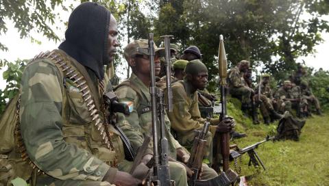 Congolese soldiers rest while being deployed against the M23 rebels near Bunagana, north of Goma