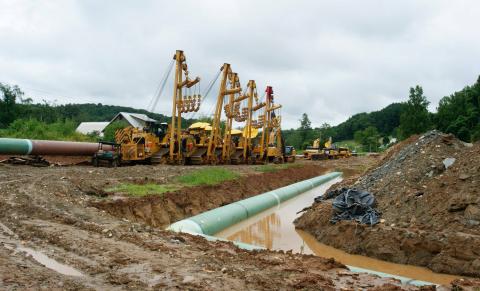 Construction equipment stands next to a house in Boones Mill, Virginia, USA, along the route of the Mountain Valley natural gas pipeline, August 2018. PHOTO BY REUTERS/Handout picture courtesy of: Anne Way Bernard