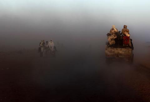 A military convoy of government forces accompanying Special Prosecutor for Crimes in Darfur Yasir Ahmed Mohamed and his team moves towards Tabit village in North Darfur, November 20, 2014. PHOTO BY REUTERS/Mohamed Nureldin Abdallah