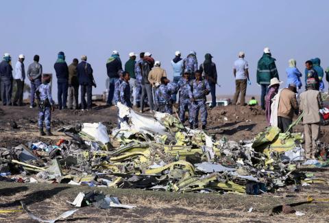 Ethiopian Federal policemen stand at the scene of the Ethiopian Airlines Flight ET 302 plane crash, near the town of Bishoftu, southeast of Addis Ababa, Ethiopia March 11, 2019. PHOTO BY REUTERS/Tiksa Negeri