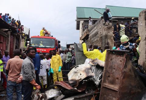 Rescuers and civilians gather at the site where a Dornier 228-200 plane operated by local company Busy Bee crashed into a densely populated neighborhood in Goma, eastern Democratic Republic of Congo, November 24, 2019. PHOTO BY REUTERS/Fiston Mahamba