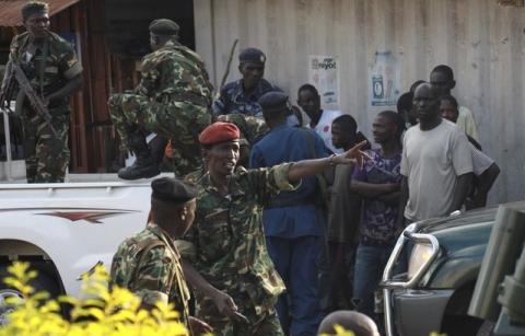 Burundi's former Defense Minister Cyrille Ndayirukiye (C) points to a direction during a attempted coup in the capital Bujumbura, May 13, 2015. PHOTO BY REUTERS/Jean Pierre Aime Harerimana